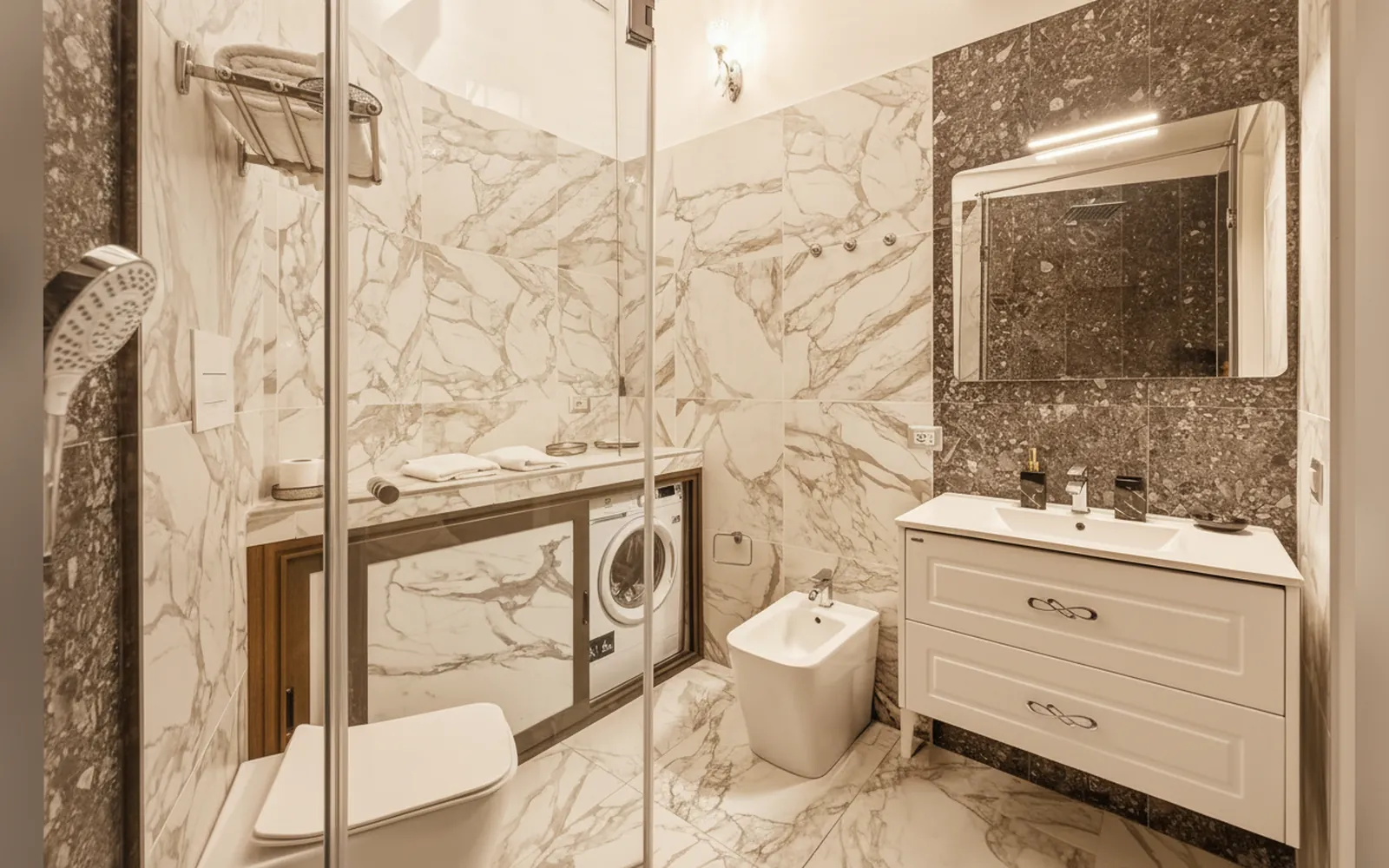 Il bagno completo con doccia, lavabo e lavatrice